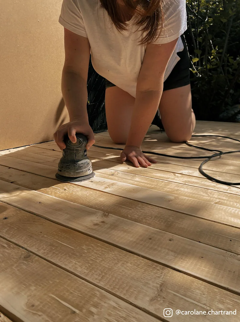 Carolane sanding the base for the stain