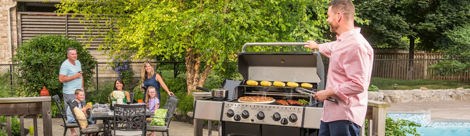 people around a barbecue 1600x464