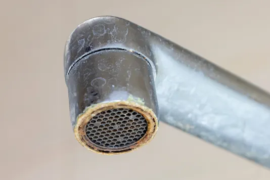A sink with mineral buildup