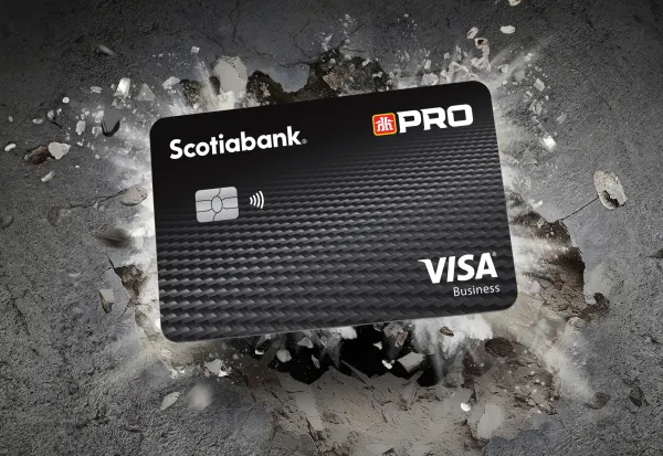 The Scotia Home Hardware PRO Visa Business Card set on a background of exploding rocks.