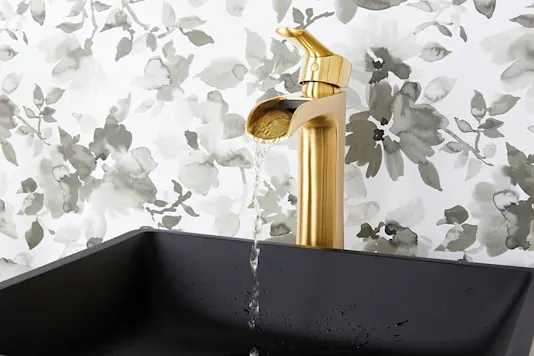 Brass faucet and black sink
