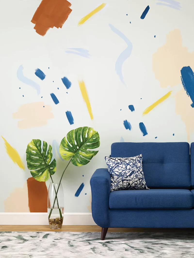 Living room wall with colourful, and random brush strokes.