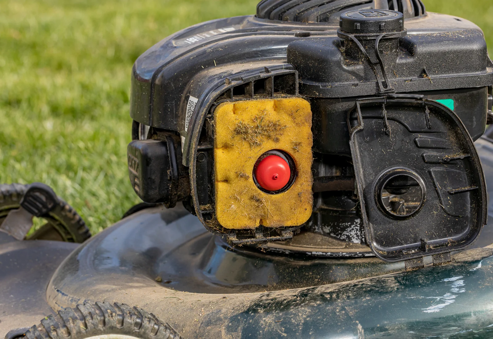 A lawnmower with a dirty engine filter