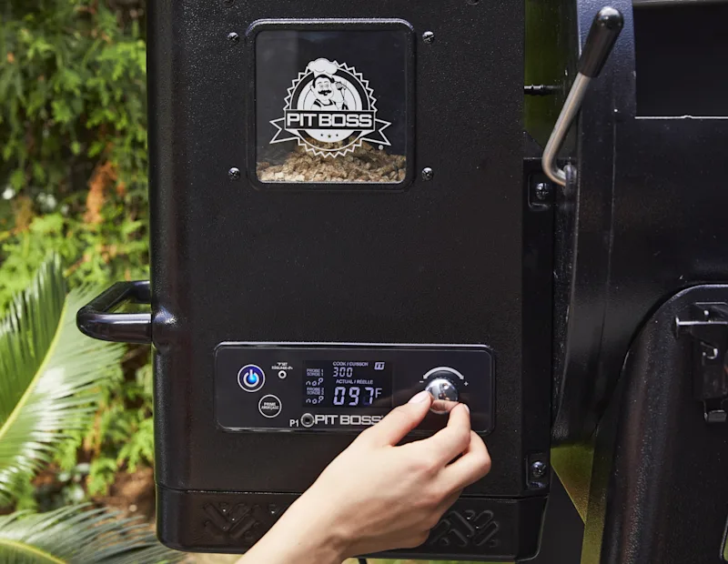 A woman turns on the smoker