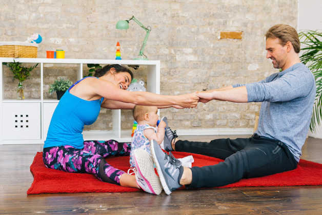 couple and baby working out