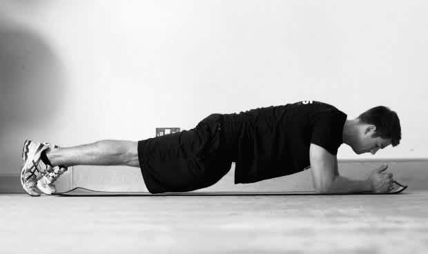 Man doing plank, black and white