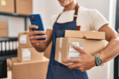 ecommerce business worker holding packages