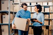 In the Background Stock of Parcels with Products Ready for Shipment