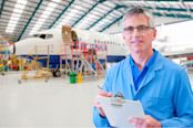 Aero Engineer Working On Aircraft In Hangar