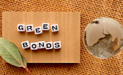 There is a word cube arranged in the shape of GREEN BONDS