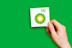 Hand holding a BP logo