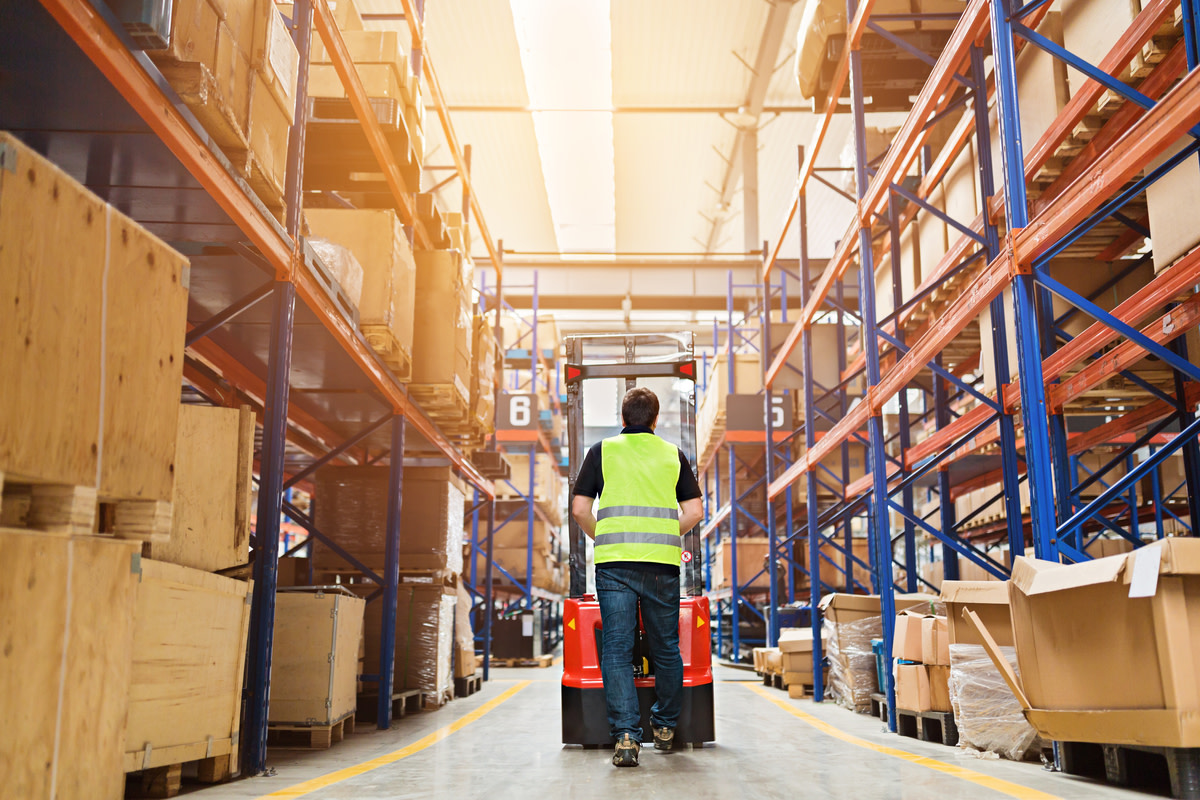 Storehouse employee in uniform working