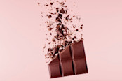 Pieces of milk Chocolate bar flying in the air