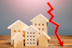 Real estate houses and a red arrow down