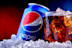 A can and a glass of Pepsi
