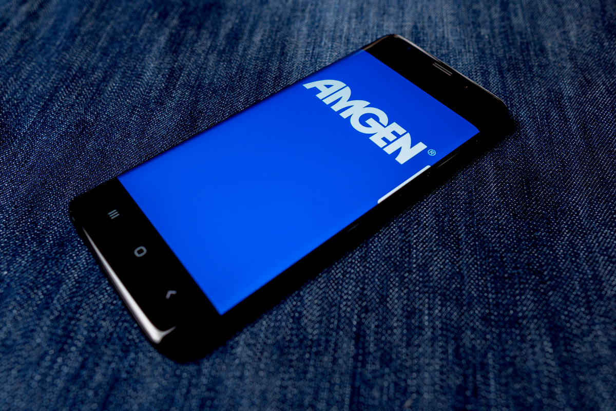 Amgen Inc logo visible on smartphone screen