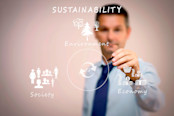 Business man writing sustainability