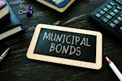 Municipal bonds written on the small blackboard