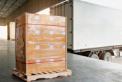 Package Boxes on Pallet Waiting to Load into Container Truck