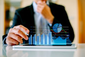 investment consultant analyzing company financial report