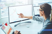 financial graphs and statistics on monitor