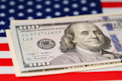 Dollar banknotes on USA America flag background