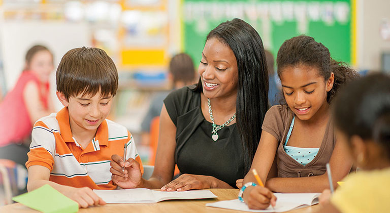 elementary-hero teacher with students