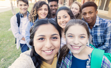 Youth standing together and taking a selfie. Youth standing together and taking a selfie.