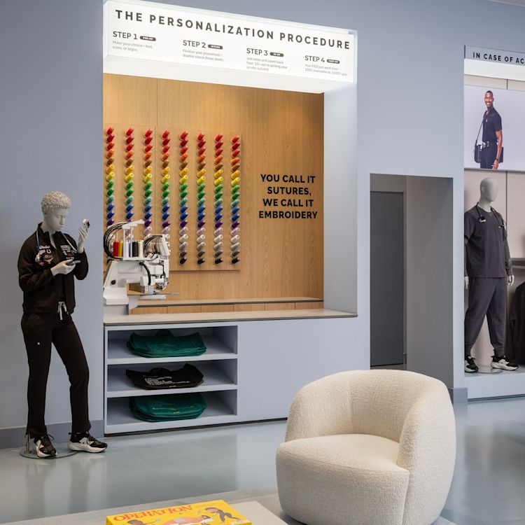 figs-mythology-interior-retail-design-houston-texas-storefront-medical-professionals-uniforms-gear-doctor-nurse-practioner-digital-displays-embroidery-machine-custom-attire