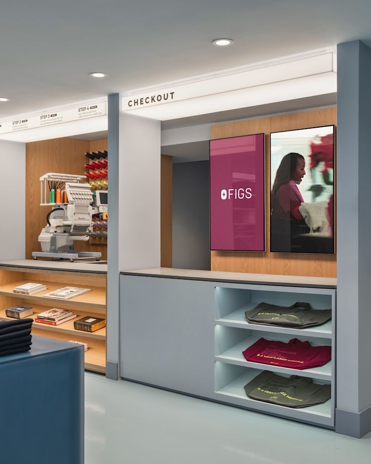figs-mythology-interior-retail-design-nyc-new-york-storefront-medical-professionals-uniforms-gear-doctor-nurse-practioner-digital-displays-embroidery-machine-custom-attire