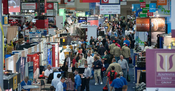 Electricians at an electrical trade show
