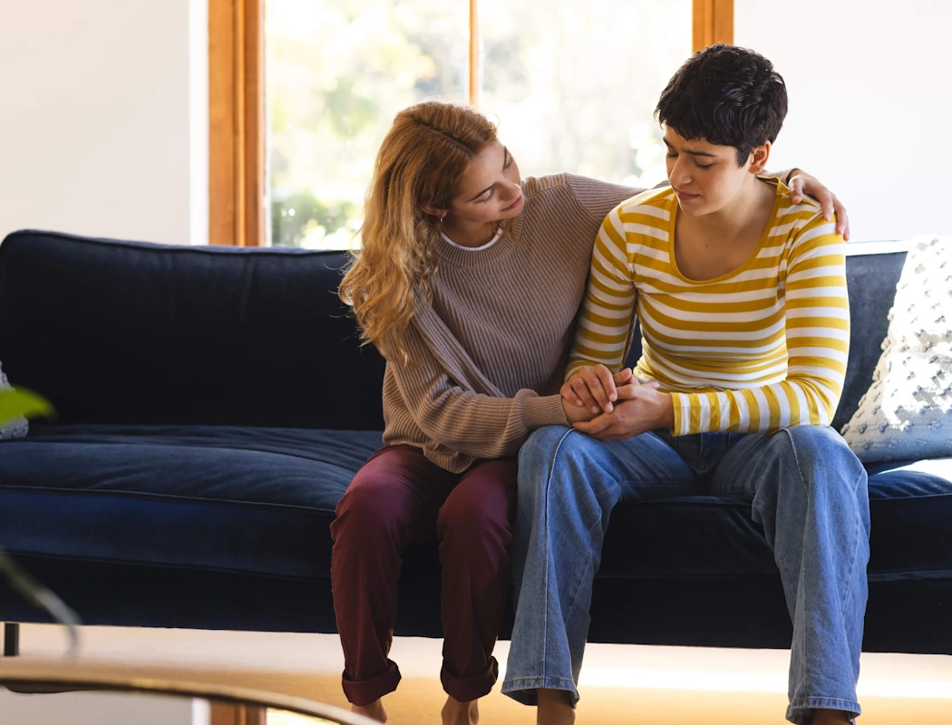 Woman is comforting another woman