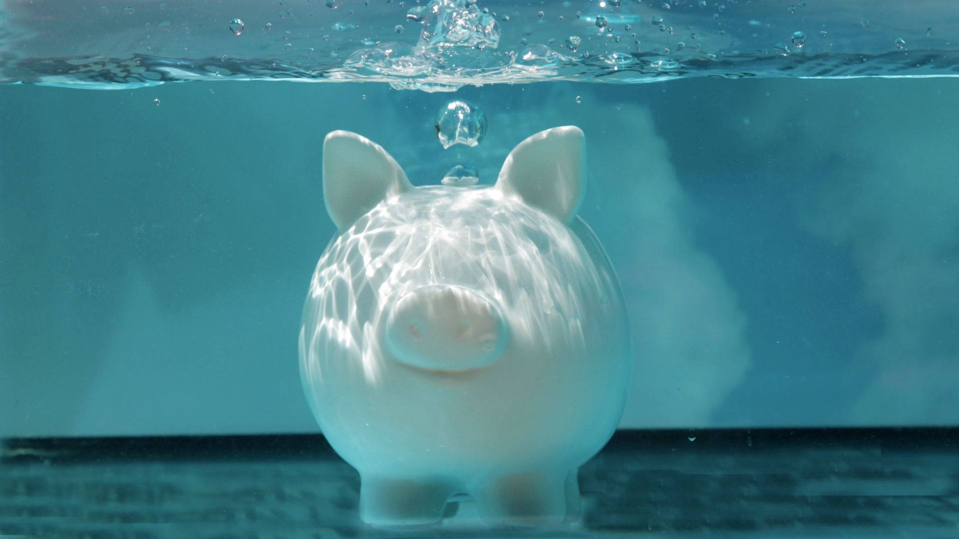 White piggy bank under the water