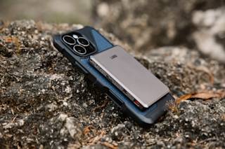 UAG SRGE Slim 5K Power Bank Portable Charger case in Black/Grey lifestyle view