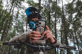 UAG Monarch Pro iPhone 17 Pro Max Case iPhone 17 Pro Max in Crimson lifestyle view