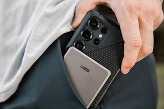 UAG SRGE Slim 5K Power Bank Portable Charger case in Black/Grey lifestyle view