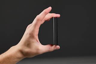 UAG Metropolis Tracker Card Tracker Card case in Black/Micro Hexagon lifestyle view