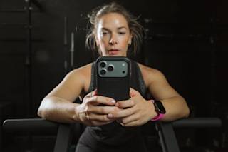 UAG Civilian iPhone 17 Pro Max Case iPhone 17 Pro Max in Olive/Orange lifestyle view