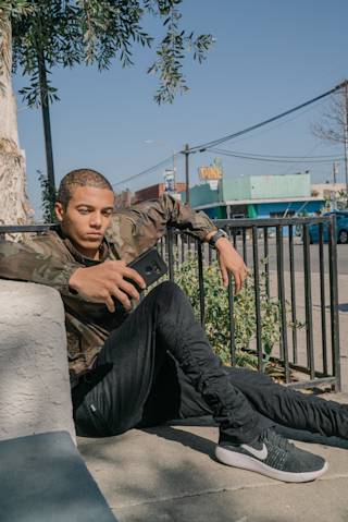 UAG Scout Series LG K8S / K8 / Tribute Empire Case K8S / K8 / Tribute Empire in Black / Scout Series lifestyle view