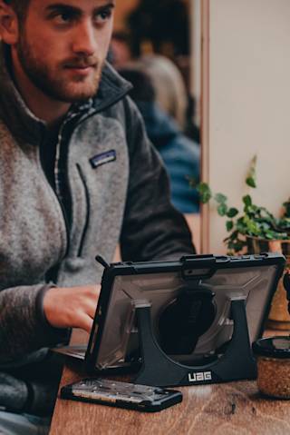 UAG Plasma Series Surface Go Case w/ Hand & Shoulder Strap Surface Go in Ice / Plasma lifestyle view