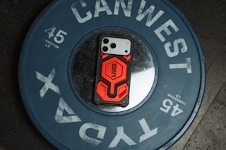 UAG Monarch Pro iPhone 17 Pro Max Case iPhone 17 Pro Max in Crimson lifestyle view