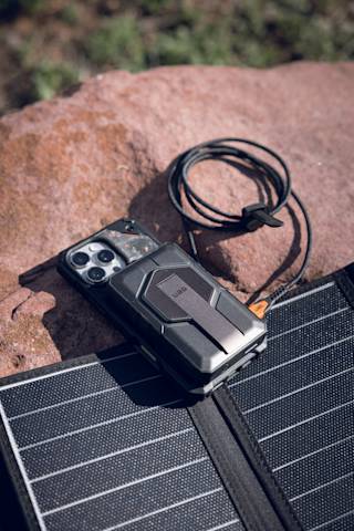 UAG SRGE Rugged 10K Wireless Power Bank With Stand Portable Charger case in Black/Grey lifestyle view