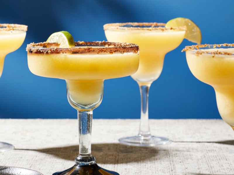 Mango margarita garnished with salt and lime