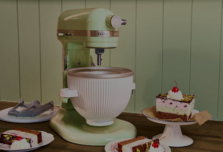 A KitchenAid® bowl-lift stand mixer with a slice of Spumoni ice cream cake
