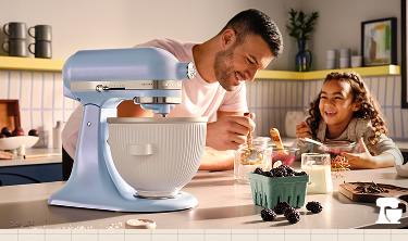 A father and child making recipes with a KitchenAid® Stand Mixer