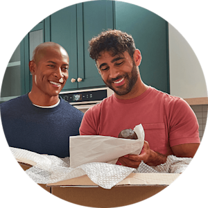 People unboxing a gift from KitchenAid®