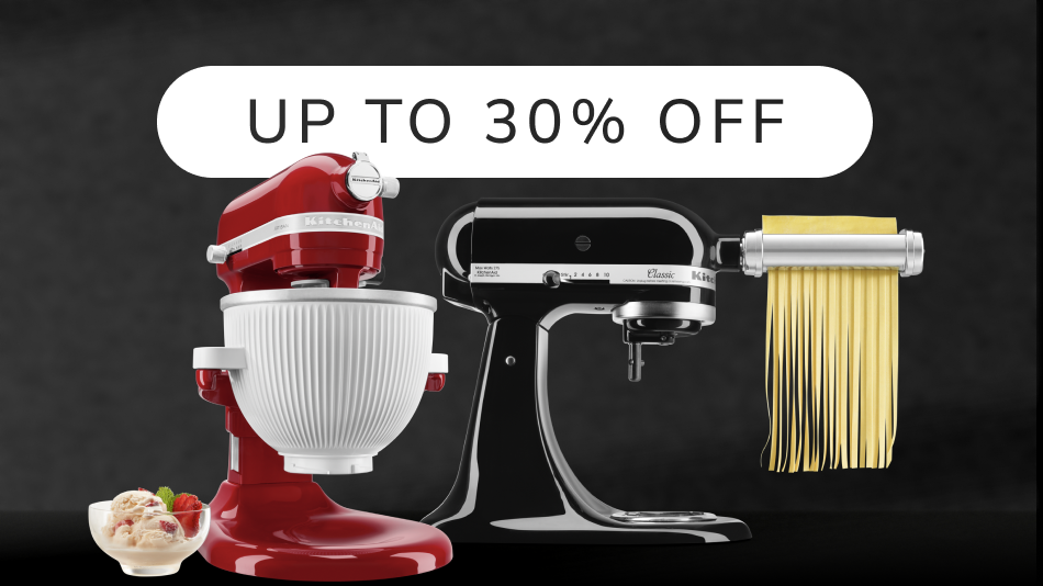 Two KitchenAid® stand mixers with a bowl of ice cream and pasta press attachment