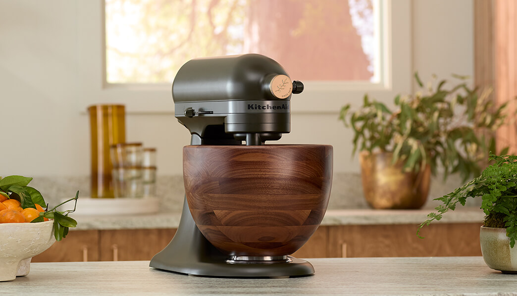 Evergreen KitchenAid® tilt-head stand mixer with a Walnut Wood Bowl on countertop