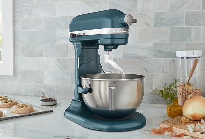 Blue KitchenAid® bowl-lift stand mixer on a marble counter