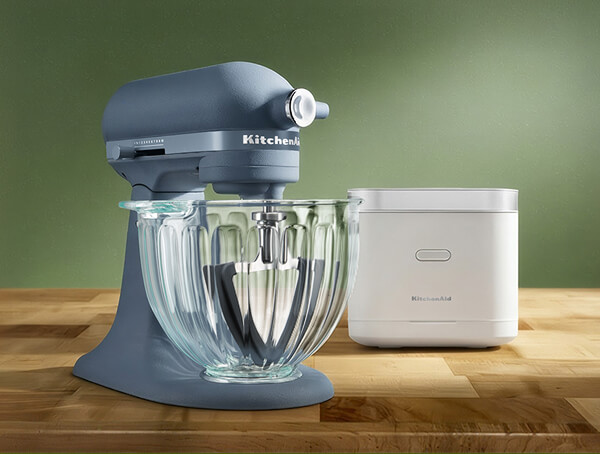 A white rice and grain cooker and a Luminaire stand mixer